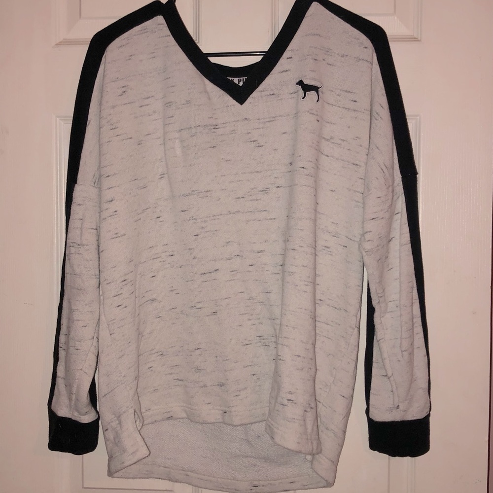 Sweater with cute Pink detailing.